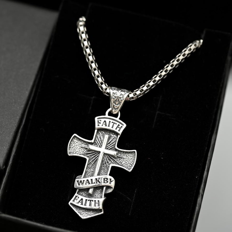 Walk by Faith Christian men’s jewelry, gift-ready faith necklace. Silver cross pendant necklace with 'Faith Walk by Faith' text on a black background