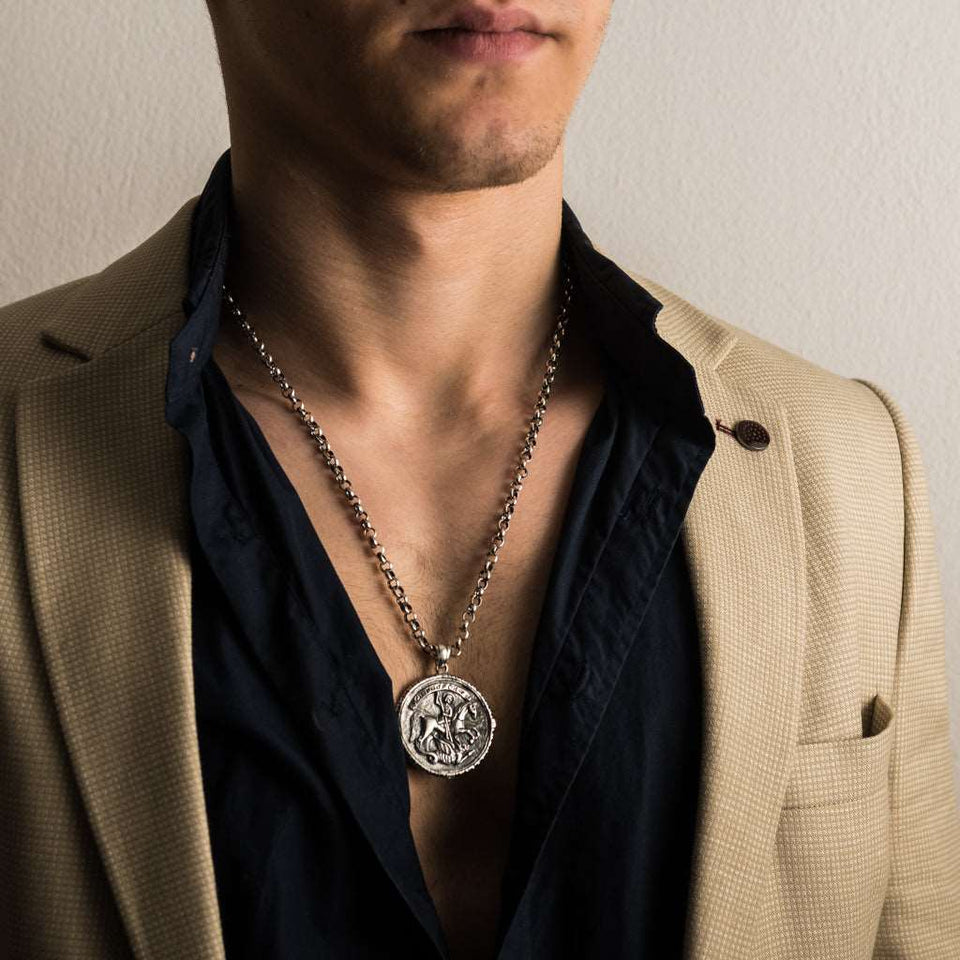 Sterling silver 925 men's pendant Saint George and the Serpent with a prayer is handmade religious jewelry and you can have it with silver chain necklace. Silver medallion St. George slaying the dragon is an amulet and a symbol of protection and it will suit with every men's style, St George locket is a perfect gift for him. Check out other best handcrafted Sterling silver Men's Jewelry at silverslegends.com