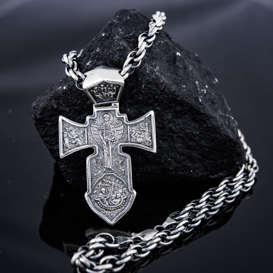 Silver Men’s Cross "Crucifixion and Guardian Angel-Michael the Archangel" is handmade, double sided cross pendant for men, from one side is Lord Jesus Christ- Crucifixion, from the other is Arhangel Michael - Guardian Angel. The lewel is with shape of sword and it’s men's solid silver pendant, you can have it with silver chain necklace. This Christian silver jewel is with beautiful details and amazing artwork. Check out other best handcrafted sterling silver men's jewelry at silverslegends.com