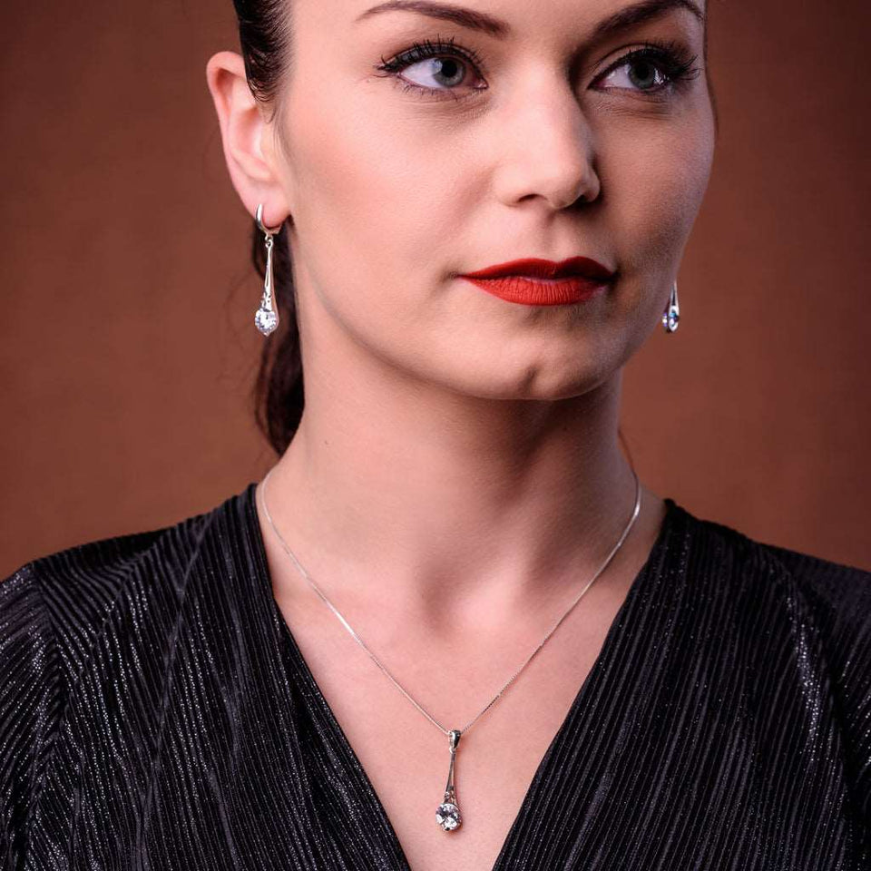 Sterling Silver 925 dangling teardrop-shaped set of pendant, necklace and earrings made with shining light blue zircon stylish design. Elegant silver jewelry female set, made with shining zircon, perfect choice as a fancy gift to your girlfriend, wife, mom, or female friends at Easter, anniversary, engagement, party, meeting, dating, wedding or usual wear. Hypoallergenic sterling silver necklace set, allergy-free. Check out other elegant jewelry for women at silverslegends.com...
