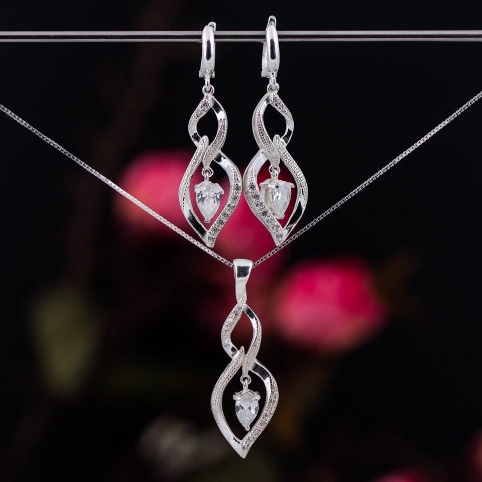 Charm sterling silver 925 jewelry set of stylish dangling and curved pendant, dainty chain necklace and earrings, made with shining zircon stylish design. Elegant silver jewelry female set, made with shining zircon, perfect choice as a fancy gift to your girlfriend, wife, mom, or female friends at Easter, anniversary, engagement, party, meeting, dating, wedding or usual wear. Hypoallergenic sterling silver necklace set, allergy-free. Check out other elegant jewelry for women at silverslegends.com...
