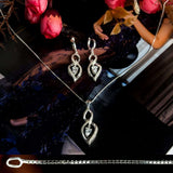 Charm sterling silver 925 jewelry set of stylish dangling and curved pendant, dainty chain necklace and earrings, made with shining zircon stylish design. Elegant silver jewelry female set, made with shining zircon, perfect choice as a fancy gift to your girlfriend, wife, mom, or female friends at Easter, anniversary, engagement, party, meeting, dating, wedding or usual wear. Hypoallergenic sterling silver necklace set, allergy-free. Check out other elegant jewelry for women at silverslegends.com...