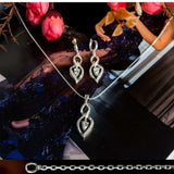 Charm sterling silver 925 jewelry set of stylish dangling and curved pendant, dainty chain necklace and earrings, made with shining zircon stylish design. Elegant silver jewelry female set, made with shining zircon, perfect choice as a fancy gift to your girlfriend, wife, mom, or female friends at Easter, anniversary, engagement, party, meeting, dating, wedding or usual wear. Hypoallergenic sterling silver necklace set, allergy-free. Check out other elegant jewelry for women at silverslegends.com...