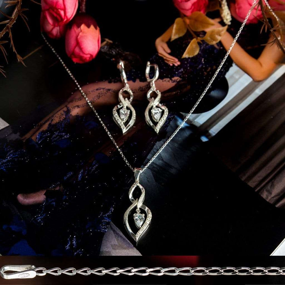Charm sterling silver 925 jewelry set of stylish dangling and curved pendant, dainty chain necklace and earrings, made with shining zircon stylish design. Elegant silver jewelry female set, made with shining zircon, perfect choice as a fancy gift to your girlfriend, wife, mom, or female friends at Easter, anniversary, engagement, party, meeting, dating, wedding or usual wear. Hypoallergenic sterling silver necklace set, allergy-free. Check out other elegant jewelry for women at silverslegends.com...