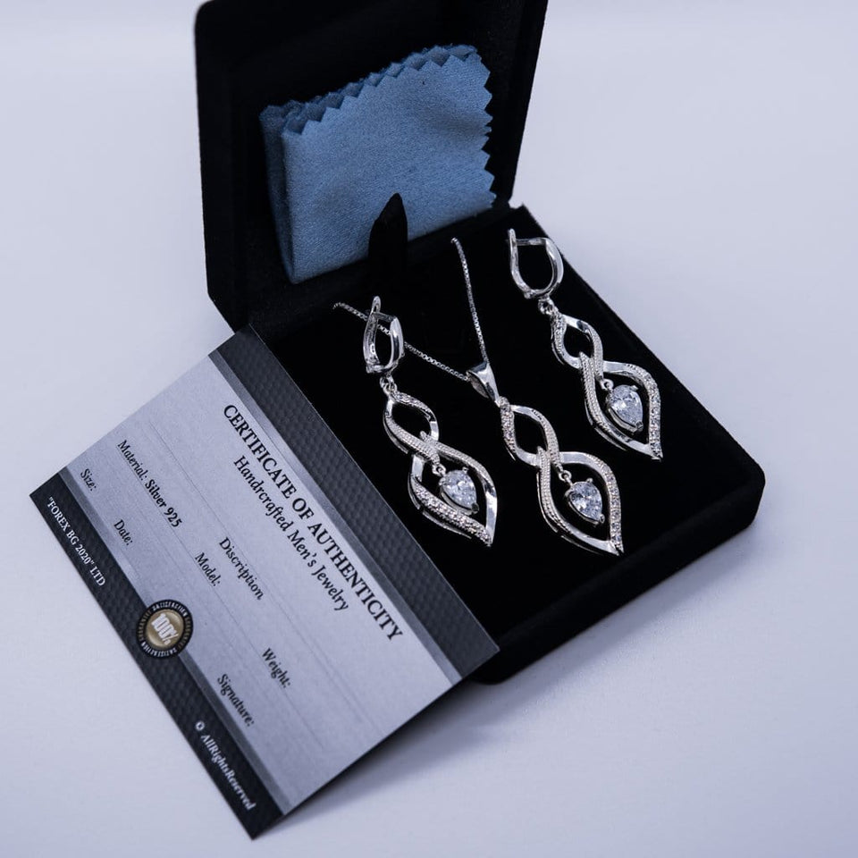 Charm sterling silver 925 jewelry set of stylish dangling and curved pendant, dainty chain necklace and earrings, made with shining zircon stylish design. Elegant silver jewelry female set, made with shining zircon, perfect choice as a fancy gift to your girlfriend, wife, mom, or female friends at Easter, anniversary, engagement, party, meeting, dating, wedding or usual wear. Hypoallergenic sterling silver necklace set, allergy-free. Check out other elegant jewelry for women at silverslegends.com...