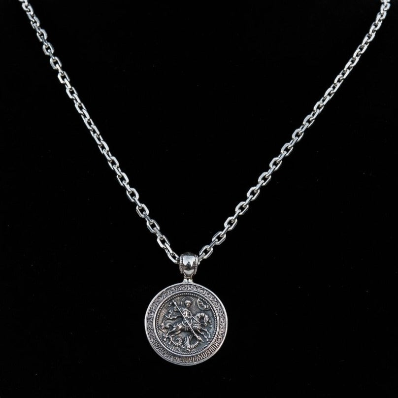Sterling silver 925 men’s pendant “St. George and the Serpent” is vintage handmade religious amulet and simbol of the protection. You can have this perfect Christian jewel with silver anchor chain necklace. The medallion symbolized Saint George and the dragon - The triumph of good over evil, through courage. Saint George pendant is a perfect gift for men and it will fit with every men's style. Check out other handcrafting jewelry at silverslegends.com…