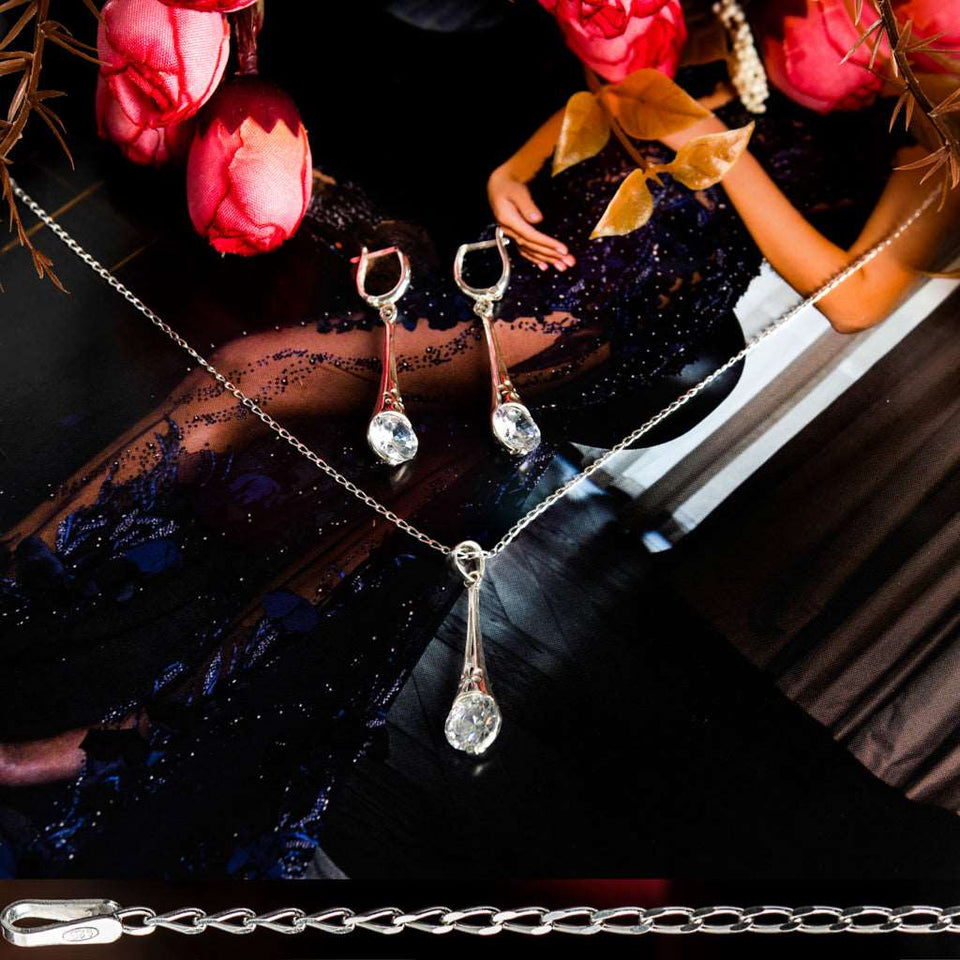 Sterling Silver 925 dangling teardrop-shaped set of pendant, necklace and earrings made with shining light blue zircon stylish design. Elegant silver jewelry female set, made with shining zircon, perfect choice as a fancy gift to your girlfriend, wife, mom, or female friends at Easter, anniversary, engagement, party, meeting, dating, wedding or usual wear. Hypoallergenic sterling silver necklace set, allergy-free. Check out other elegant jewelry for women at silverslegends.com...