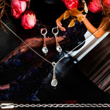 Sterling Silver 925 dangling teardrop-shaped set of pendant, necklace and earrings made with shining light blue zircon stylish design. Elegant silver jewelry female set, made with shining zircon, perfect choice as a fancy gift to your girlfriend, wife, mom, or female friends at Easter, anniversary, engagement, party, meeting, dating, wedding or usual wear. Hypoallergenic sterling silver necklace set, allergy-free. Check out other elegant jewelry for women at silverslegends.com...