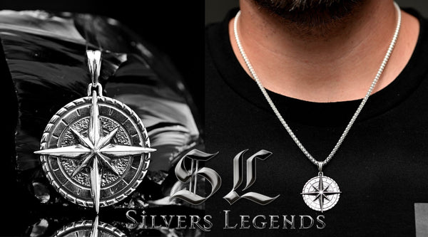 Man wearing silver compass pendant – modern symbolic jewelry.