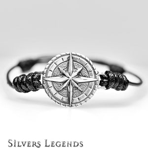 Bracelet with compass design on a gray background, branded 'Silvers Legends'.