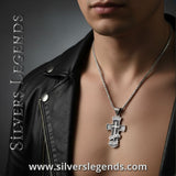 Person wearing a silver cross necklace with 'Silvers Legends' branding, Handcrafted Sterling Silver Cross with Walk by Faith Engraving – Religious Jewelry for Men