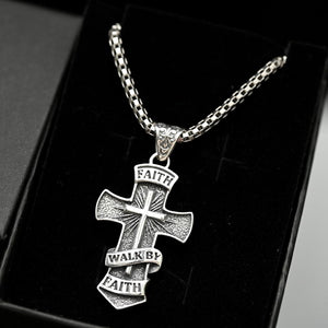 Walk by Faith Christian men’s jewelry, gift-ready faith necklace. Silver cross pendant necklace with 'Faith Walk by Faith' text on a black background
