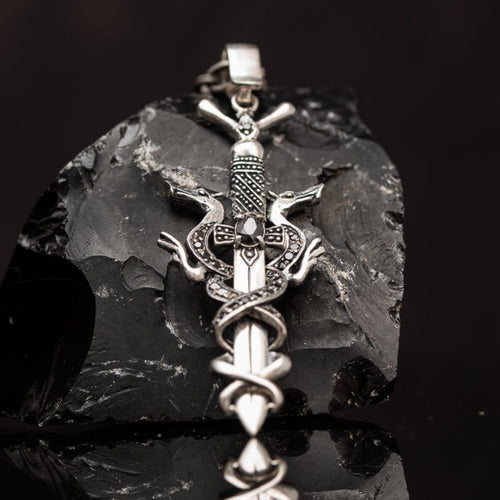 Sword pendant silver, Sterling silver 925 pendant with Dragons with black onyx stones is Handmade dragon jewel. This sword pendant with armor of intertwined dragons is a celtic silver amulet with two options то wear, the whole pendant with dragons, or only the sword... Silver dragon locket for men is an awesome gift for him, and it suit with every men’s style. Check out at silverslegends.com