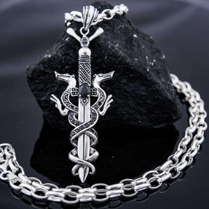 Sterling silver 925 pendant with Dragons with black onyx stones is Handmade dragon jewel. This sword  pendant with armor of intertwined dragons is a celtic silver amulet with two options то wear, the whole pendant with dragons, or only the sword... Silver dragon locket for men is an awesome gift for him, and it suit with every men’s style. Check out at silverslegends.com
