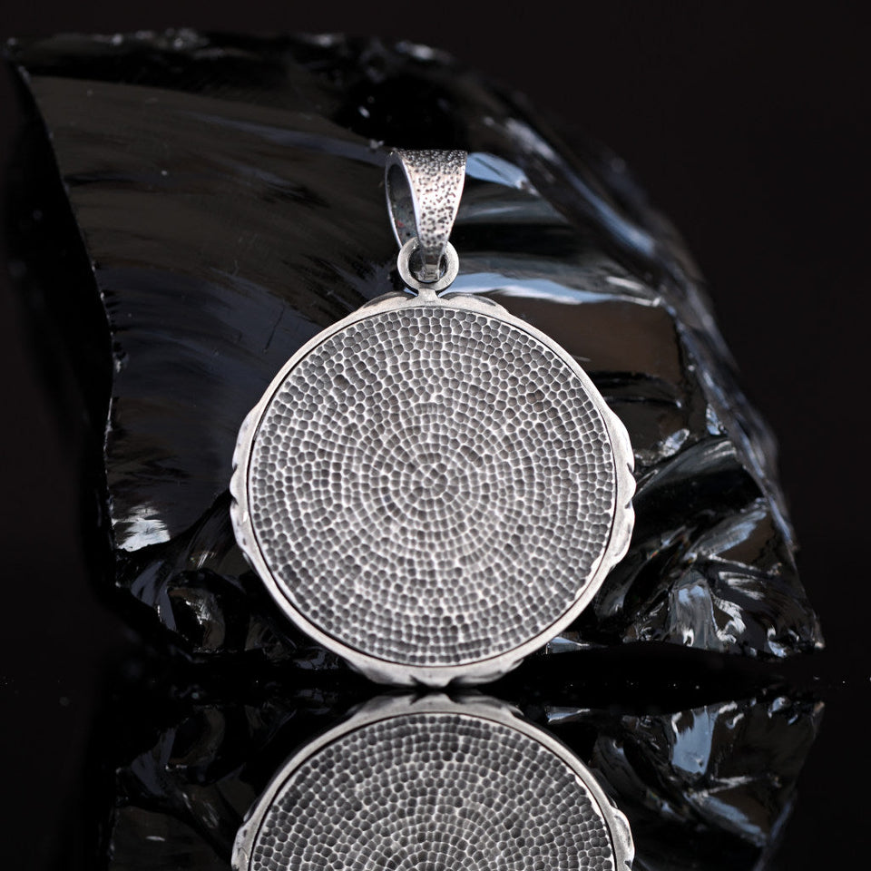 Back of silver Saint Michael pendant, engraved with Catholic prayer symbol and antique oxidized finish, men’s faith jewelry handcrafted from sterling silver.